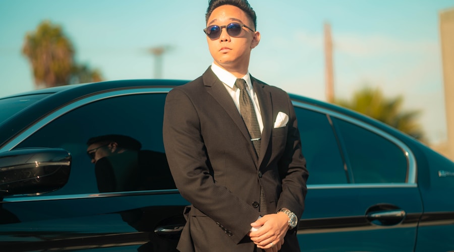 Chauffeur beside black car